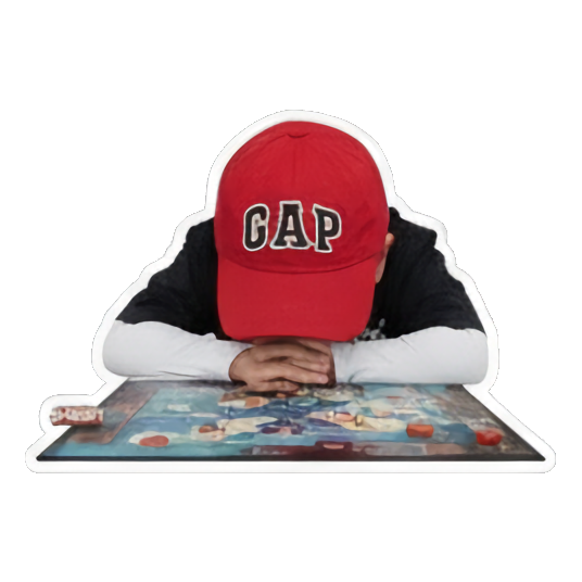 Child frustrated, face down on game board, 'RAGE QUIT'. Game Night Kid sticker for expressive chats and social replies.